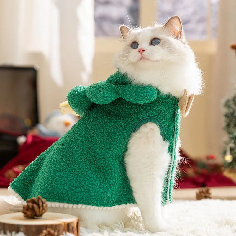 Brown elk patterned hooded cloak on a cat, sized for winter warmth.