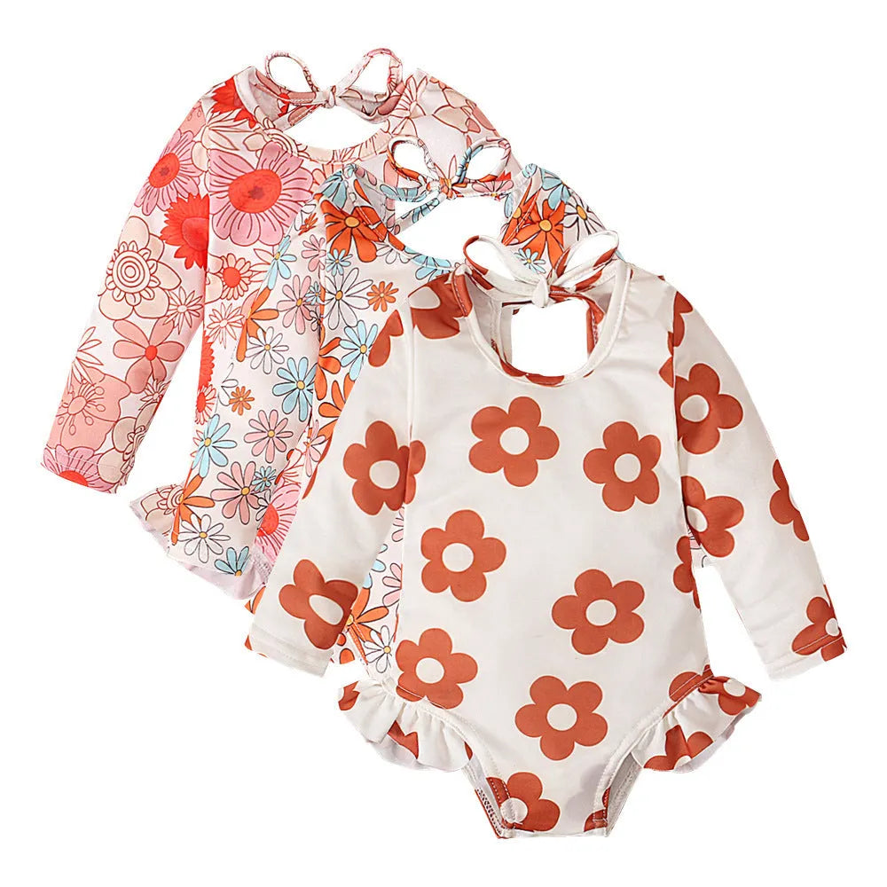 Girl's floral pattern open back swimsuit in orange red, available in sizes 70 to 110 yards.