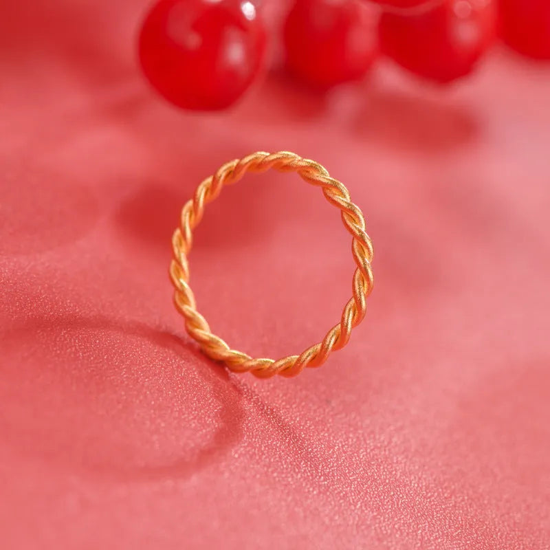 Women's simple bracelet style brass gold plated ring shown in twist, matte and glossy finish variations.