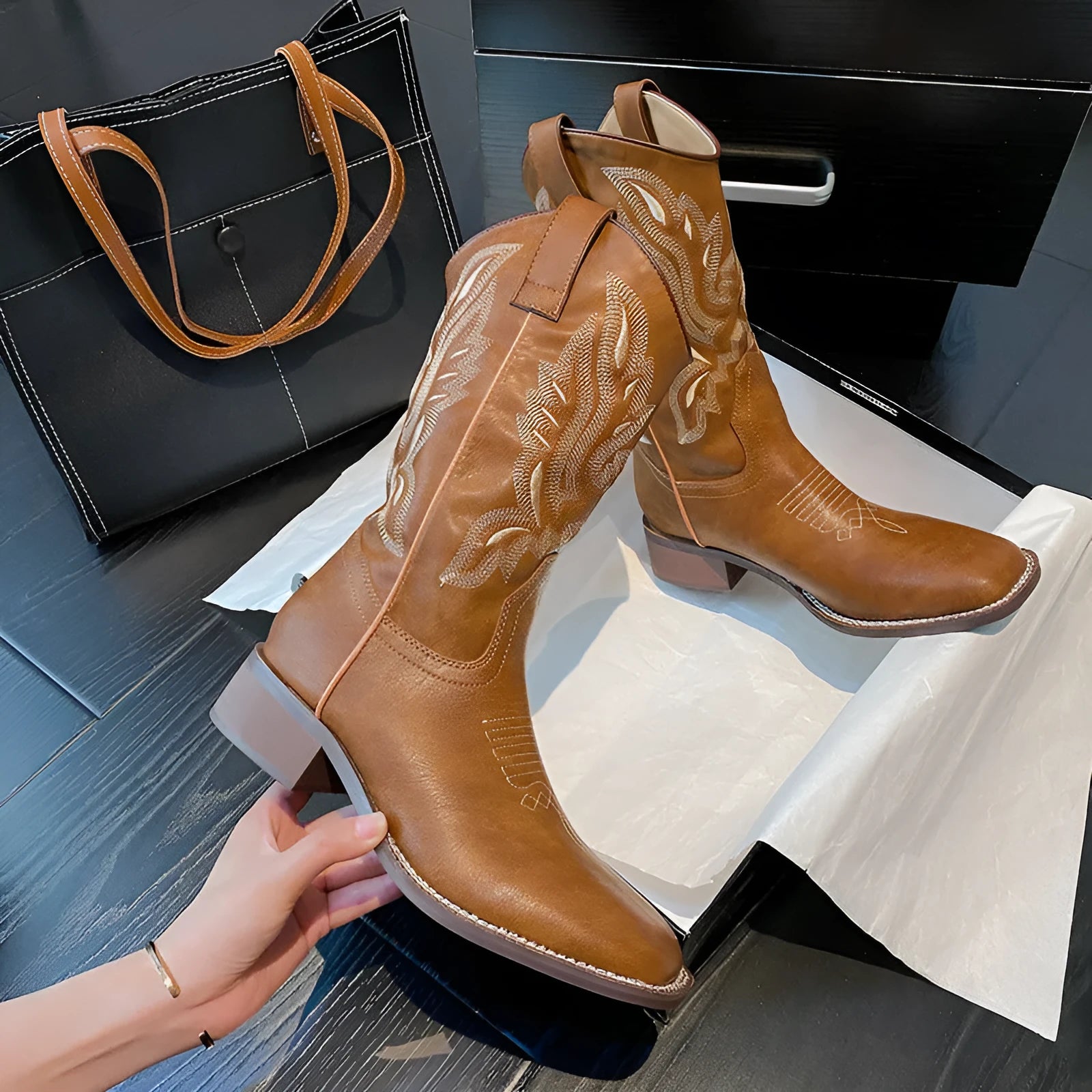 Brown women's mid-calf Martin boots with embroidery and a square low heel.