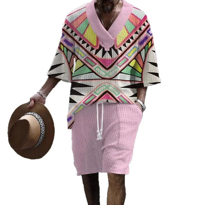 Man wearing a loose fit casual short sleeve suit with matching shorts in a light colour.