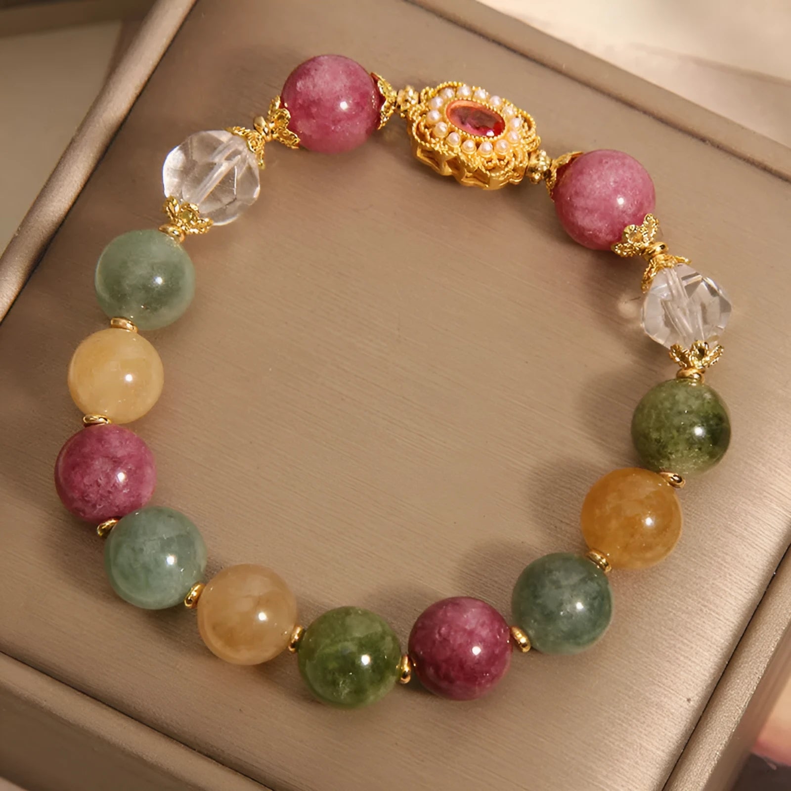 Women's jade colour tourmaline bracelet with alloy setting and rhinestone elements on pearl crystal base