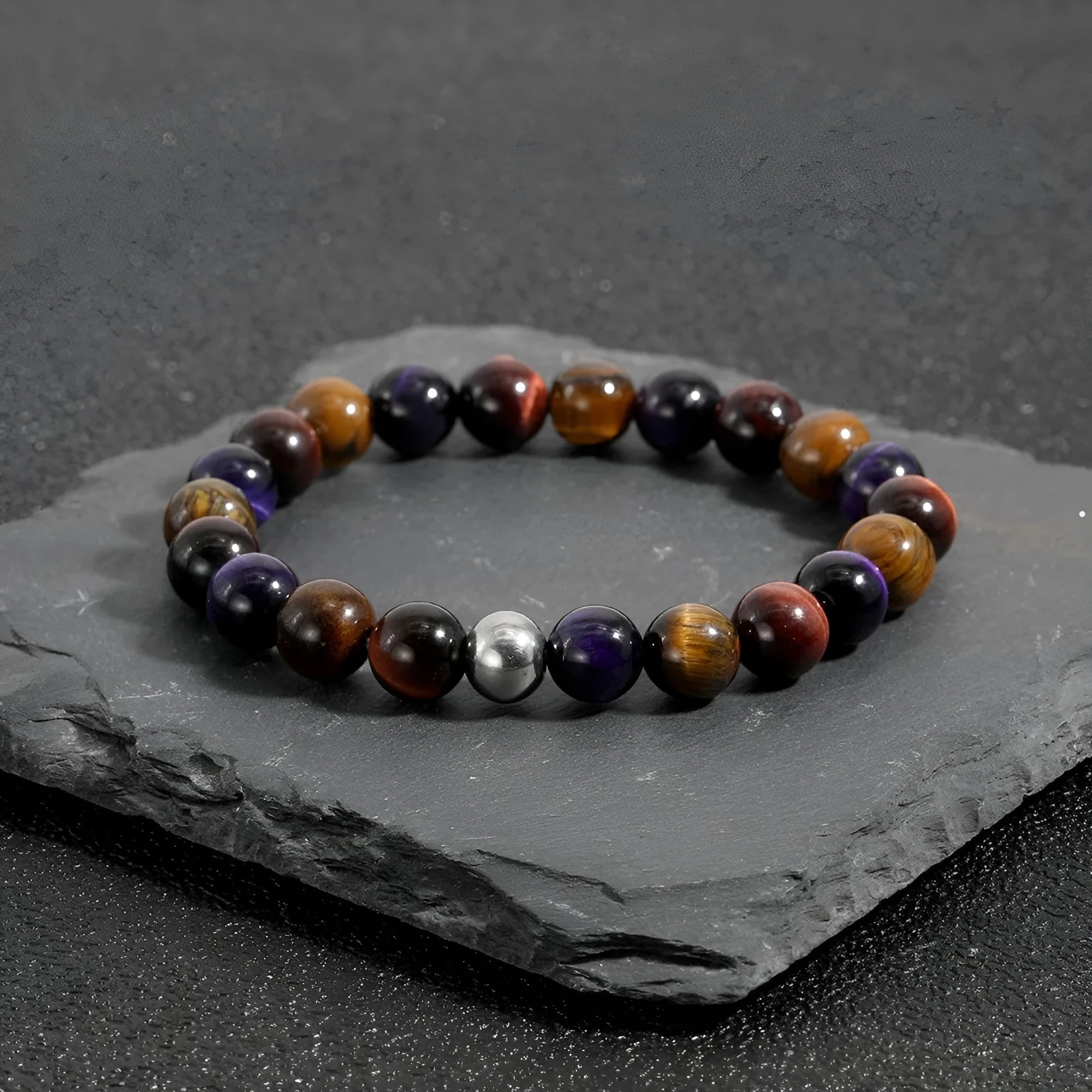 Minimalist elastic bracelet with a geometric natural tiger-eye stone in yellow, purple, or red.