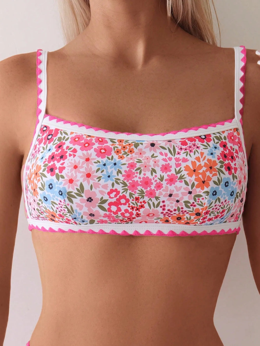 Women's printed lace-up bikini swimsuit with split briefs on a mannequin.