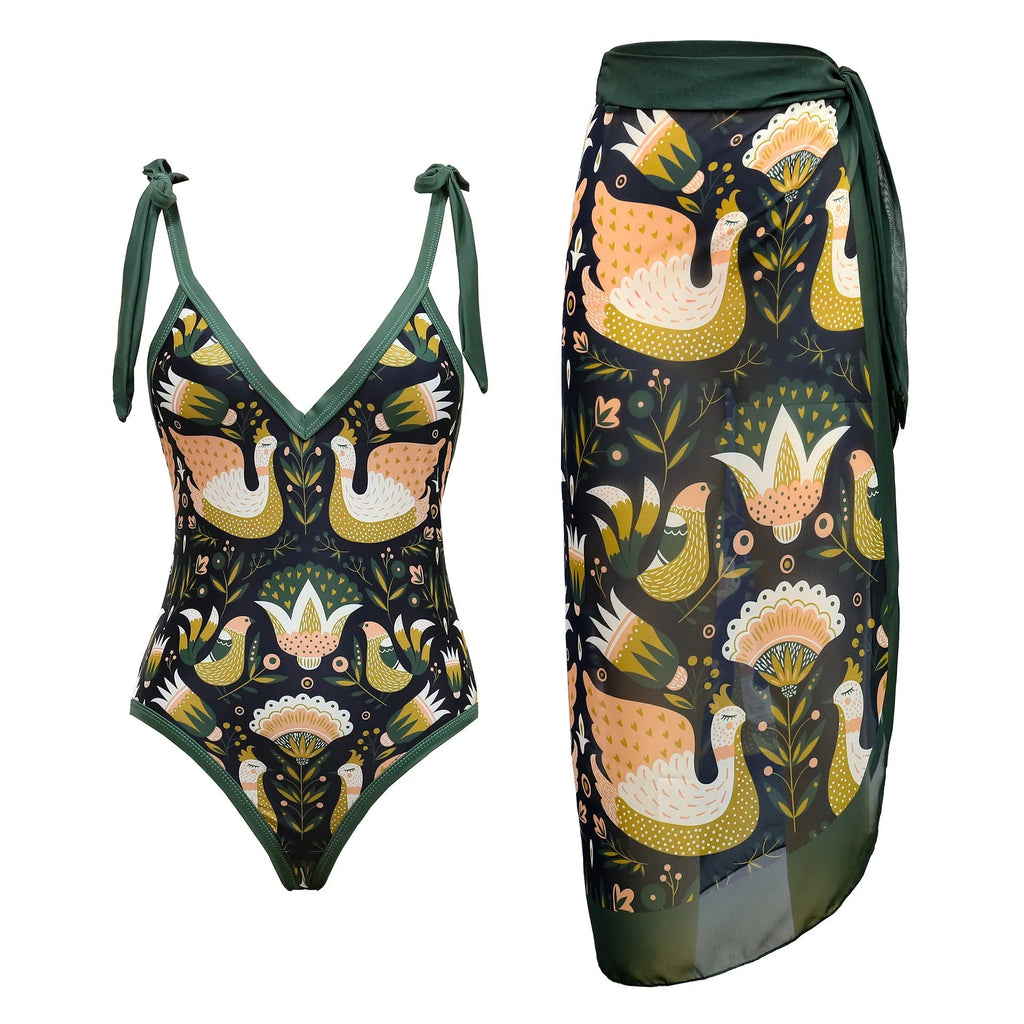 Solid colour women's one-piece swimsuit with thin spaghetti straps and a removable wrap skirt.