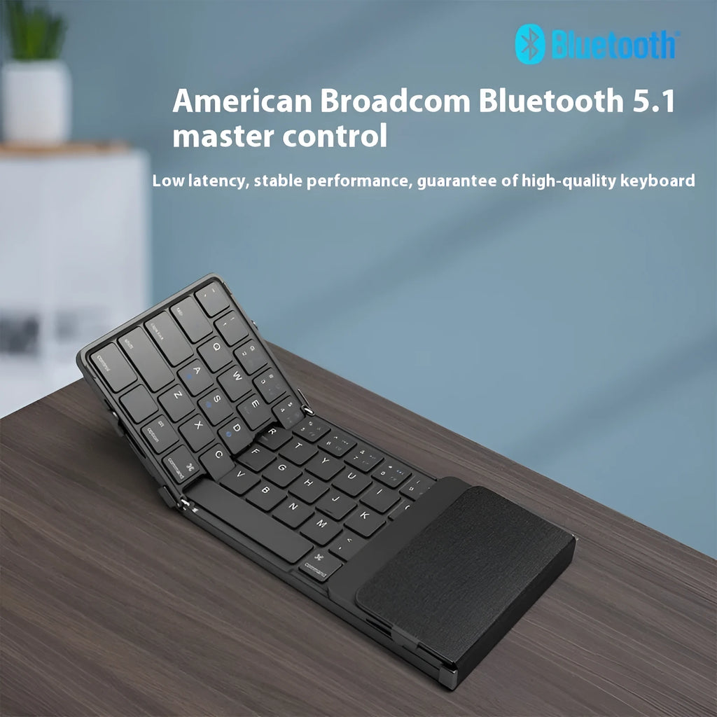 Black folding Bluetooth keyboard for mobile phones and tablets, shown next to a phone.