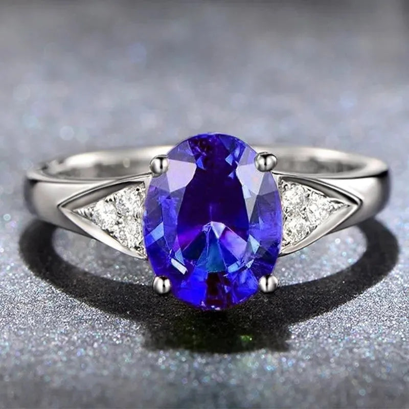 Women's court style ring set with natural blue and red zircon stone inlays in heart, water drop, and bell patterns.