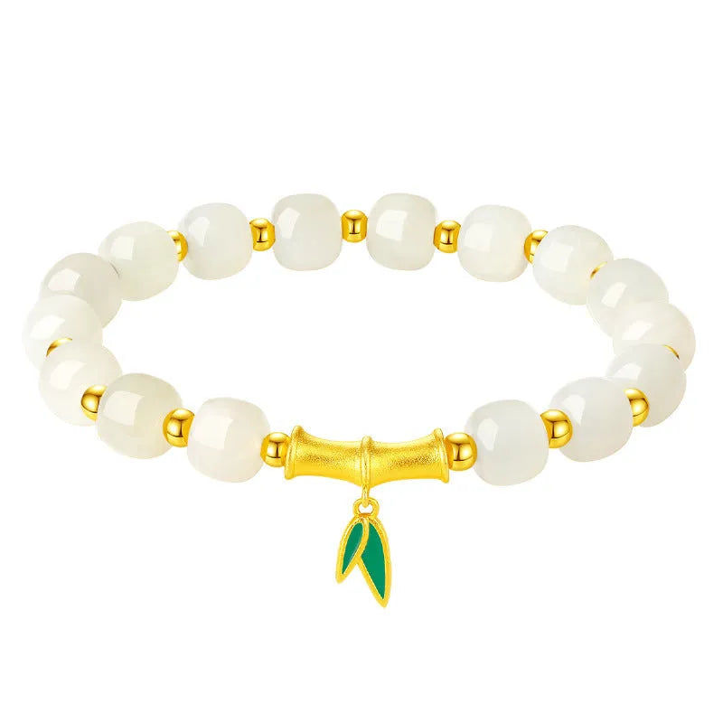Sterling silver bracelet with gold Hetian jade beads and bamboo leaf charms