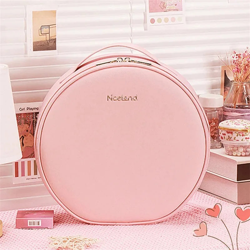 Round cherry blossom pink PU leather makeup bag with a lit LED mirror inside, showing internal partitions.