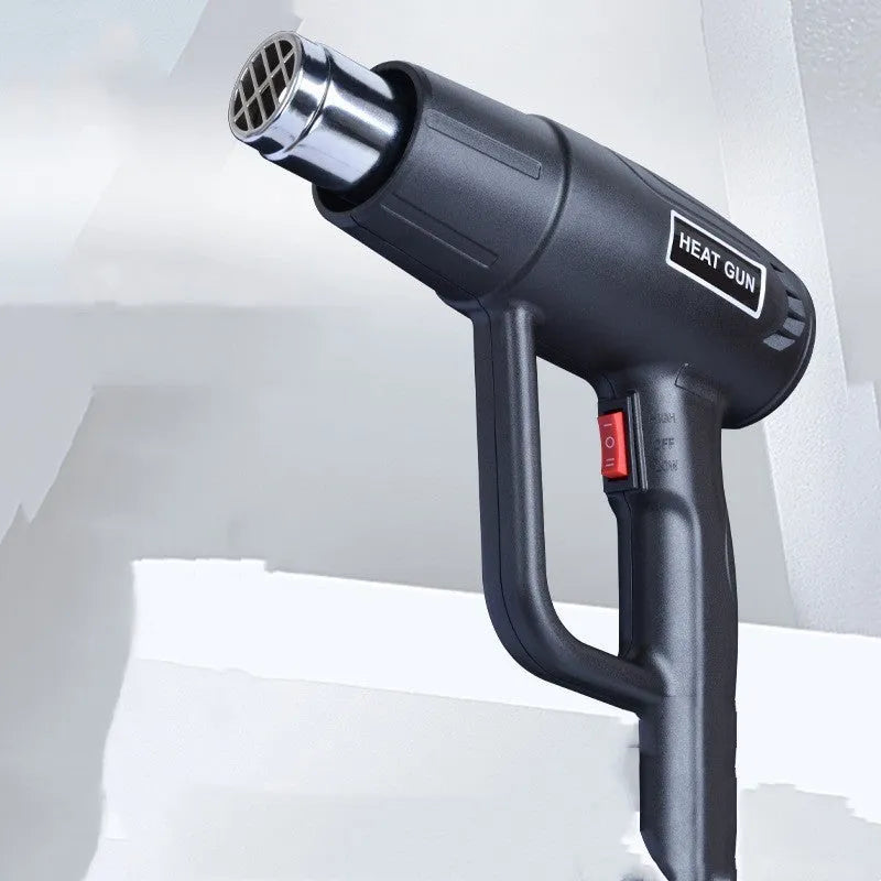 2000W industrial hot air gun with a non-slip thermal shell and a grid-type air outlet.