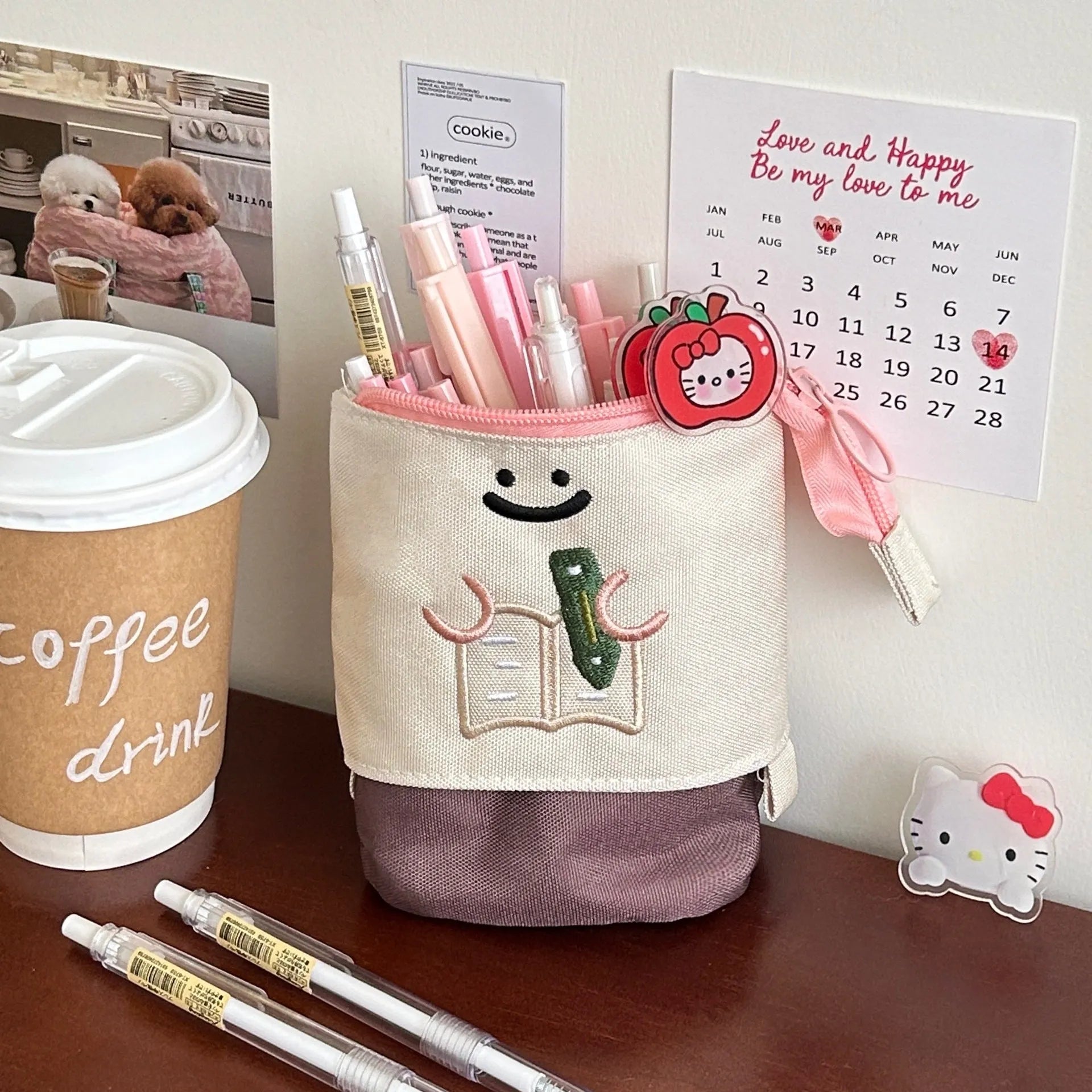 Brown cartoon pattern collapsible pencil case with zipper closure showing interior space