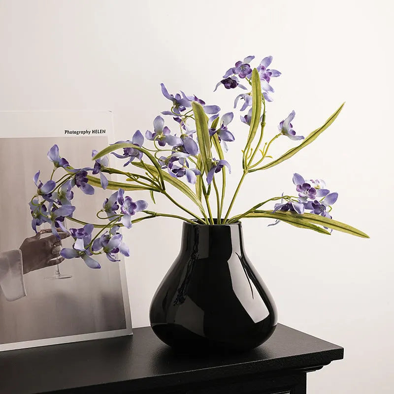 Ceramic vase with glass surface in black or white colour featuring coloured glaze finish and modern simple style