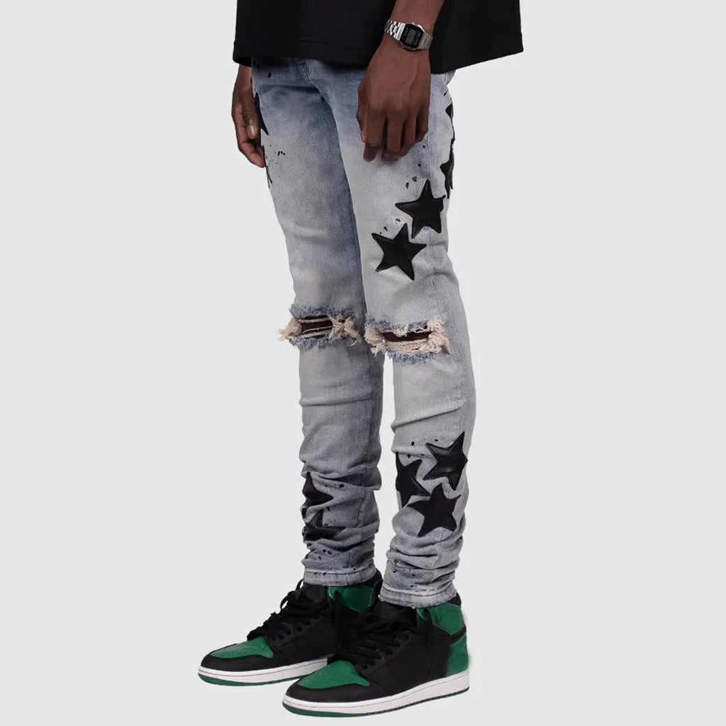 Men's slim fit stretch jeans in blue with mid waist and subtle embroidery detail on denim.