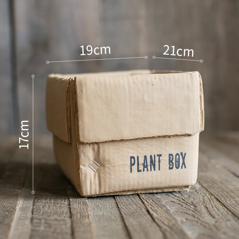 Cement brown paper box style flowerpot with bottom drainage holes for indoor plants
