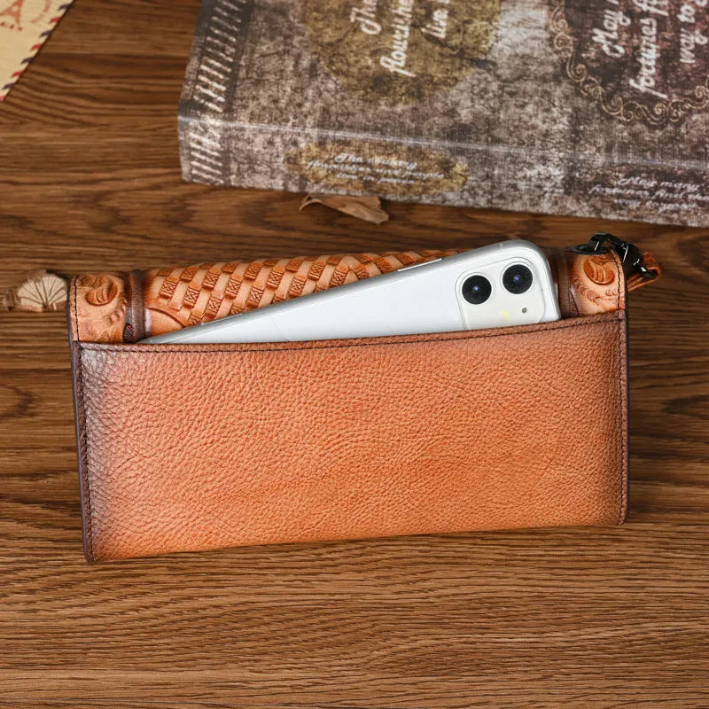 Retro brown embossed Chinese floral pattern on a genuine leather tri-fold women's wallet.