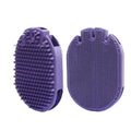 Purple dual-sided pet shampoo massage brush with soft TPR bristles and ergonomic handle.