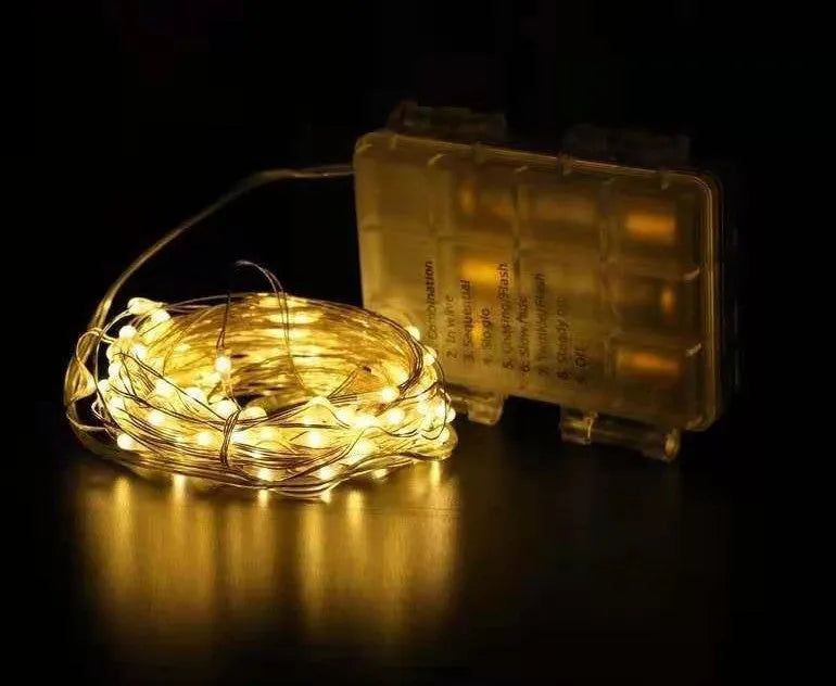 12-metre long copper wire LED string lights with 120 bulbs and a USB plug, displayed with a light post.