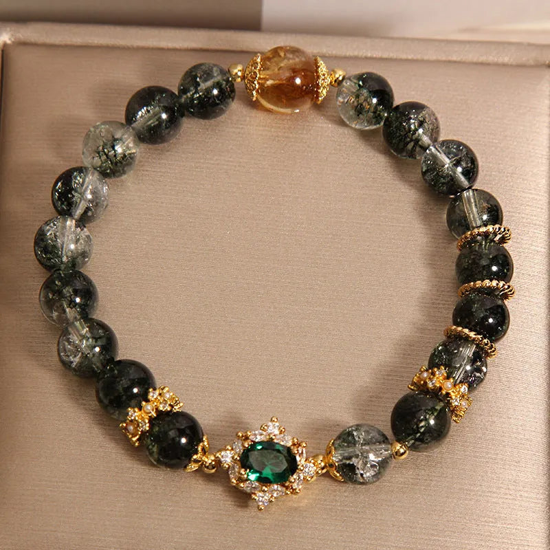 Gold rutilated quartz women's bracelet with green phantom quartz, ruby quartz beads and crystal accents