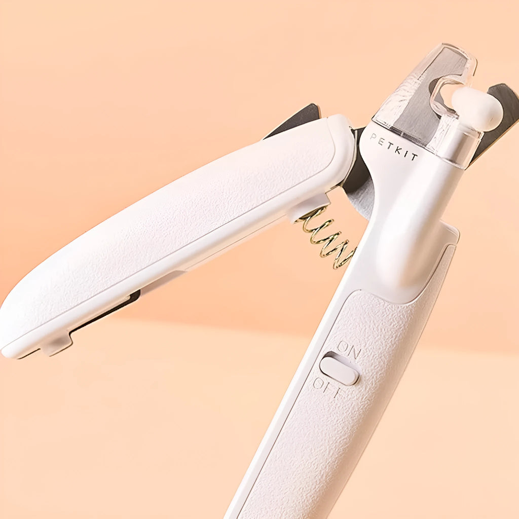 White pet nail clipper with LED light, transparent anti-splash guard, and leather-like handle