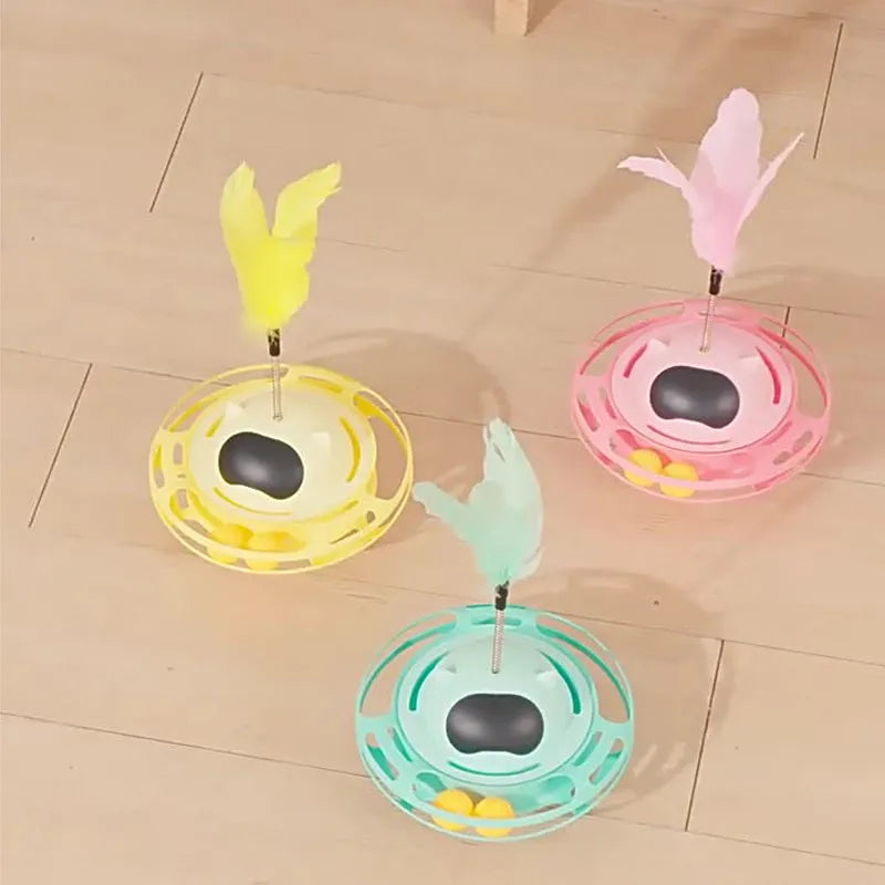 Pink cat stick toy with rotating tumbler turntable measuring 17cm by 10cm