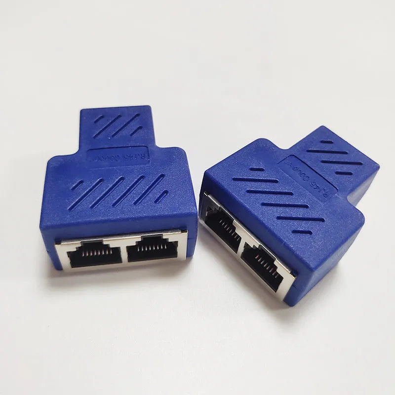 White RJ45 three-way network cable splitter adapter on a black background.