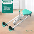 Pink and blue adjustable leg stretching trainer with steel frame and foam padding on a studio floor.