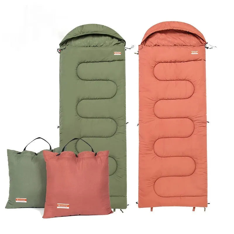 Ochre and olive green ultra-light cotton sleeping bag quilt for camping, shown folded and portable.