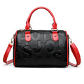 Cylindrical PU crossbody bag with three shoulder straps in red or brown colour with polyester lining