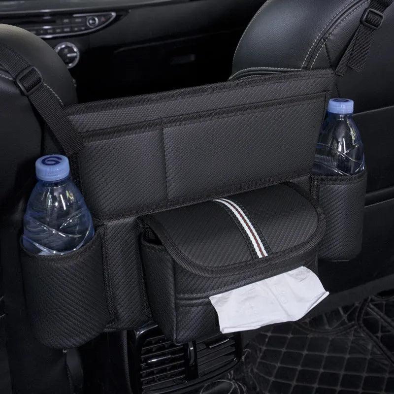 Black leather car seat hanging storage organiser for tissue boxes, shown between vehicle front seats.