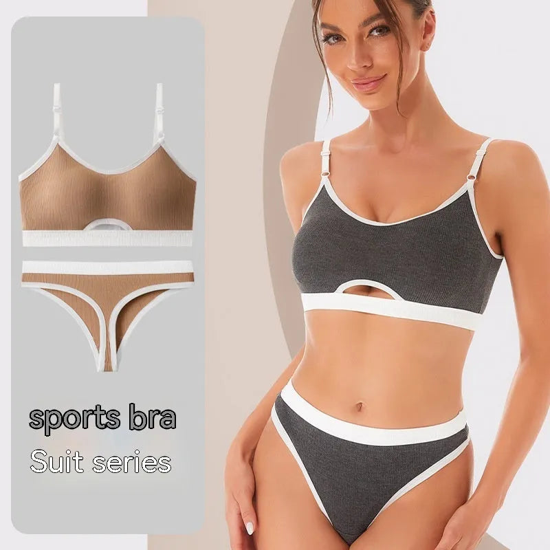 Women's black sports bra and panty set with underwire, moulded cups, and contrast colour back detailing.