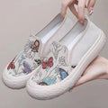 Old Beijing women's slip-on canvas shoes in black or white with a round toe and shallow cut.