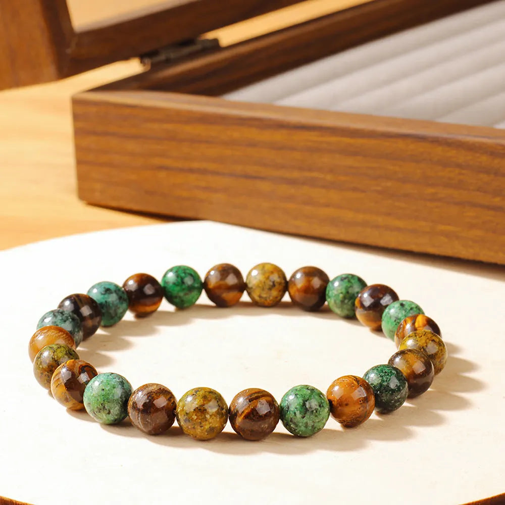 Handmade Tigereye stone fortune bracelet with antique style floral carving measuring 18mm
