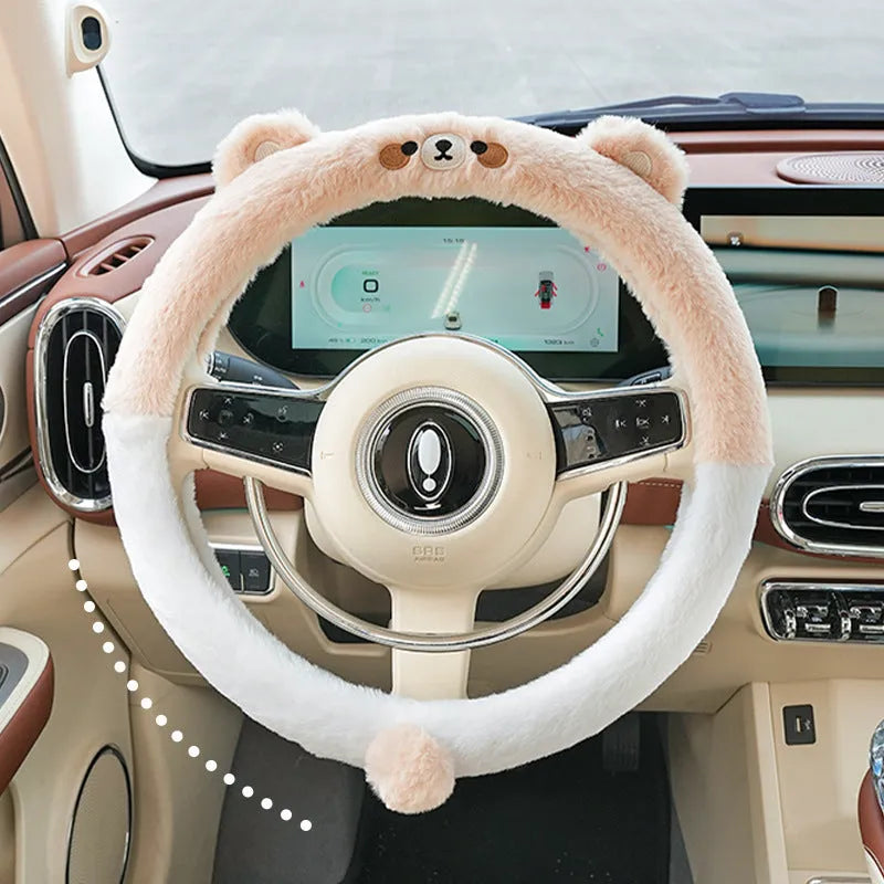 Plush winter steering wheel cover with embroidered cartoon bear design, sized for 38cm diameter wheels.