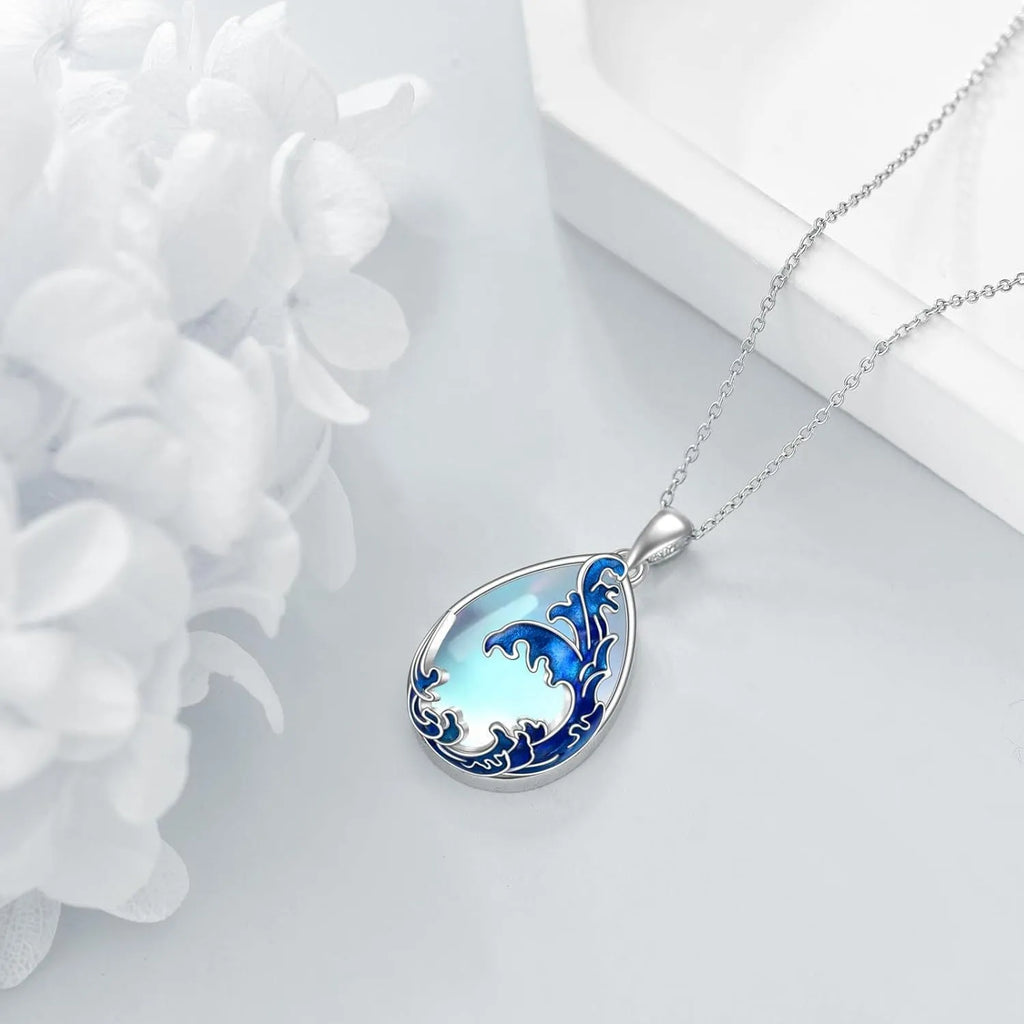 Blue moonstone pendant in a silver heart charm on an adjustable alloy necklace chain.