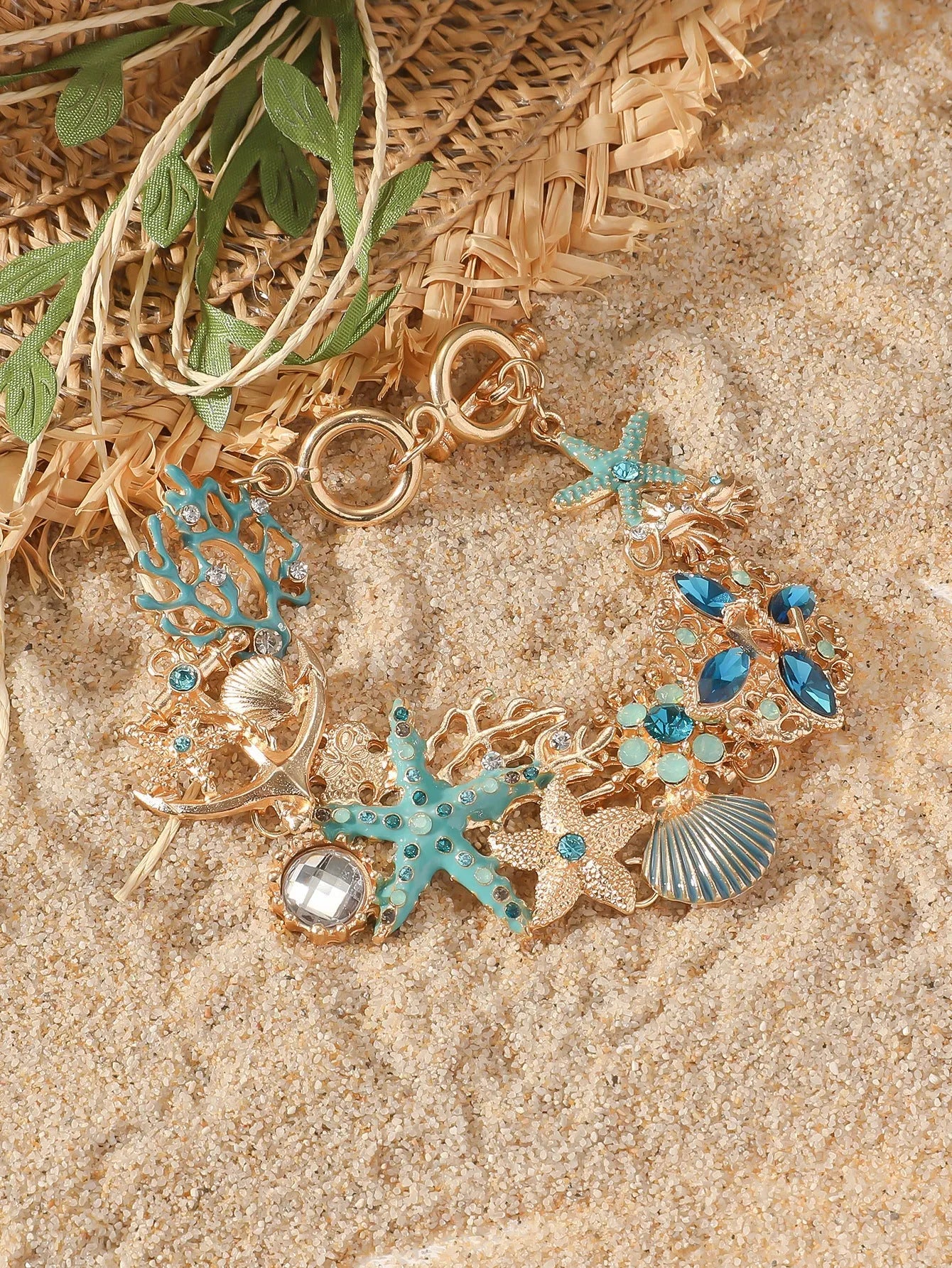 Alloy marine-themed bracelet with anchor and starfish charms in blue colour