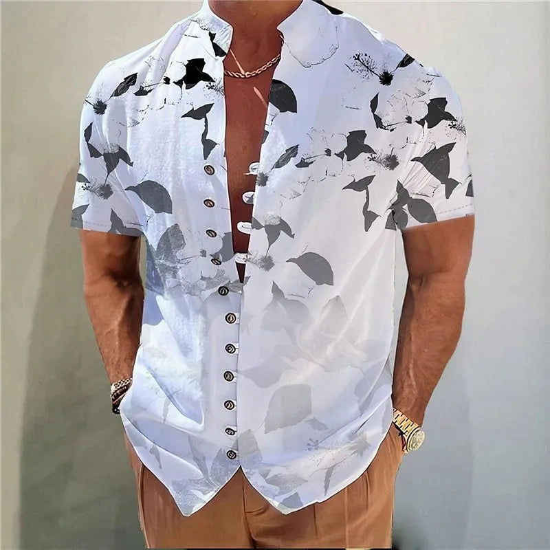 Youth model wearing a short sleeve cardigan with a blue and white geometric floral print pattern.