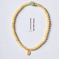 Hand-woven women's topaz bracelet with 6mm lucky barrel beads and square sugar jade beads in yellow jade colour