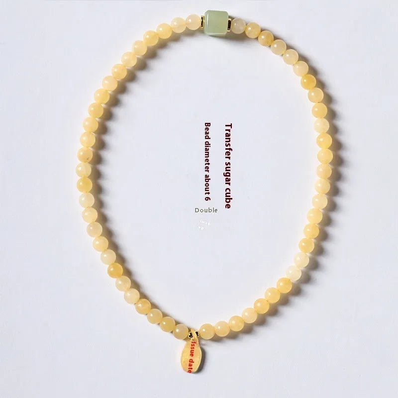 Hand-woven women's topaz bracelet with 6mm lucky barrel beads and square sugar jade beads in yellow jade colour