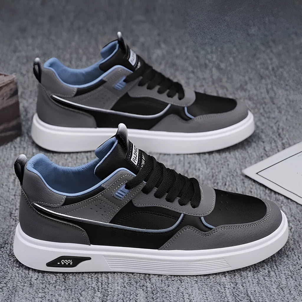 Men's low-top canvas board shoes in black, beige, or grey with round toe and leather stitching.