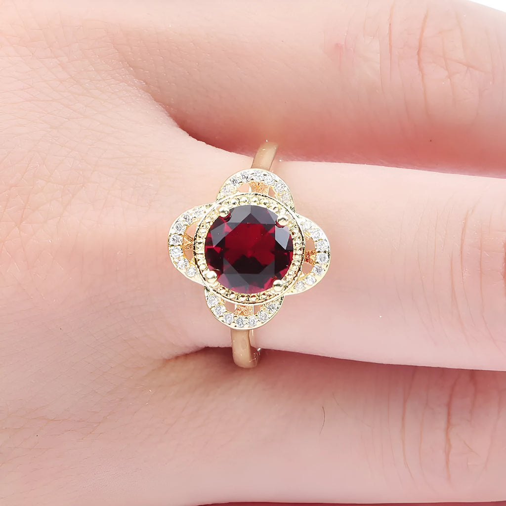 Copper fruit-shaped ring with a zircon stone, showing electroplated finish.