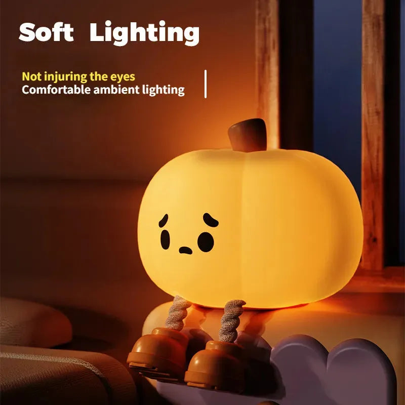 Soft silicone pumpkin-shaped night light with warm yellow glow