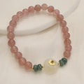 Women's strawberry quartz and blue water emerald bracelet with round jade pendant and geometric design