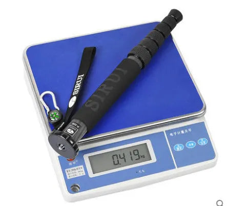 Black carbon fibre telescopic monopod for SLR cameras, shown at full extension.