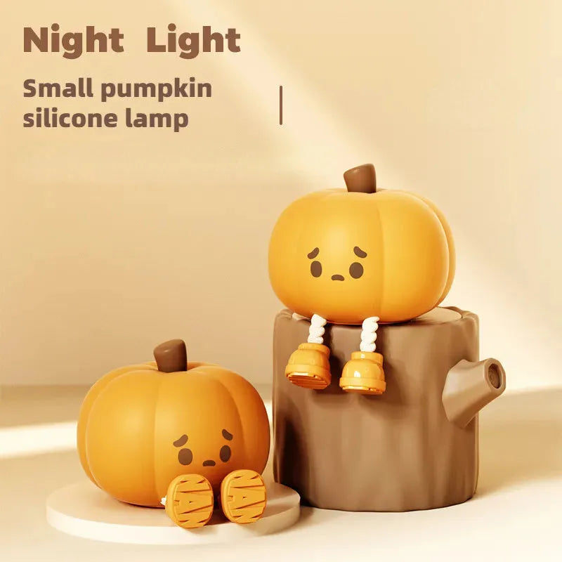 Soft silicone pumpkin-shaped night light with warm yellow glow