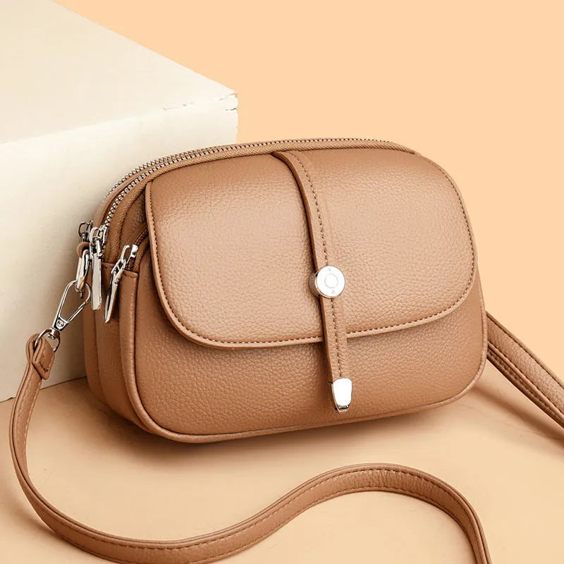 City Simple women's crossbody shoulder bag in soft PU leather with oval suitcase shape and sewing thread detailing