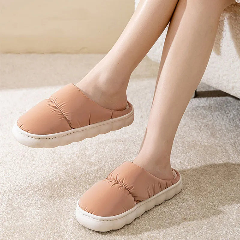 Down cotton house slippers with artificial leather upper, rubber sole, and plush lining in blue colour