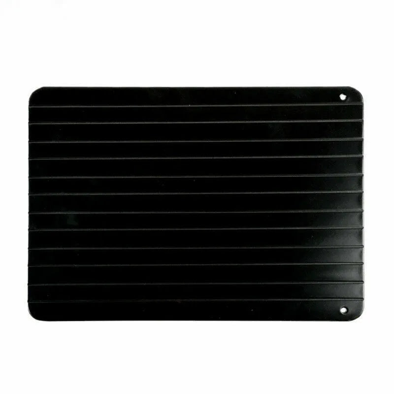 Black aluminium fast defrosting tray for thawing frozen meat and food.