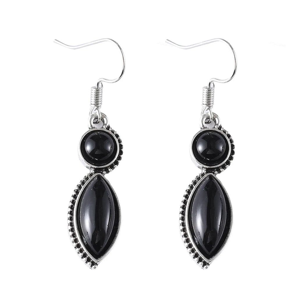 A pair of vintage geometric pendant earrings in black and purple with a Bohemian style.