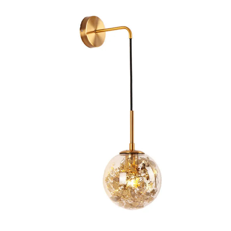 Modern glass wall lamp with golden flower finish and warm white LED light.