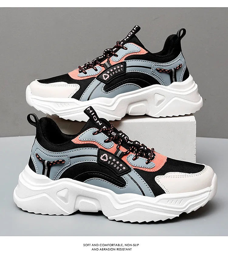 Women's white and black mesh casual sports shoes with thick sole, buckle closure, and round toe.